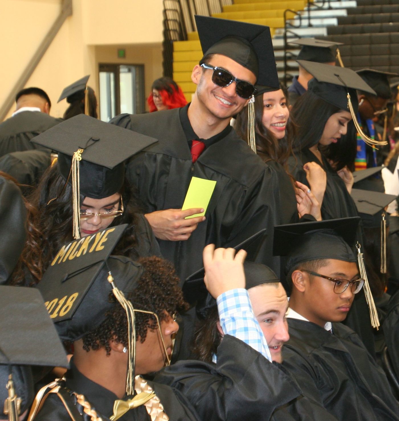 ACHS 2018 graduation smiles in the gym
